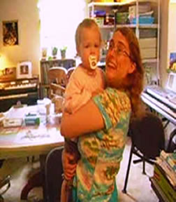 Mommy holding Sabrina in the Dining Room
